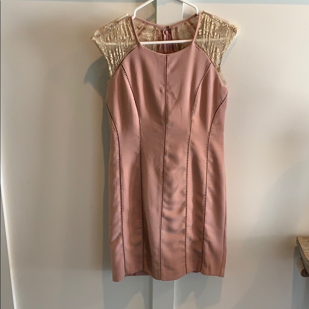 Neutral color dress. Beautiful lace back detail.